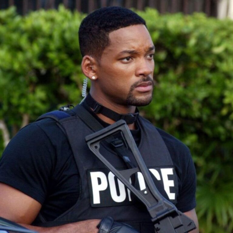 Will Smith takes on the role of a charismatic police officer in the movie "Bad Boys." With his confident demeanor and a sharp short crop hairstyle, he embodies the perfect blend of toughness and charm that makes this film a thrilling ride.